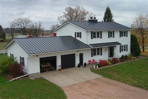 charcoal grey metal roof white brick house|gray metal roofing.